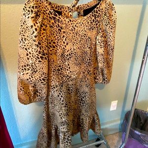 Anthropologie leopard print party dress with back cutouts.